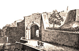 particolare della cinta muraria con la "Porta all'Arco", porta etrusca con arco a tutto sesto, ornato da tre teste in tufo